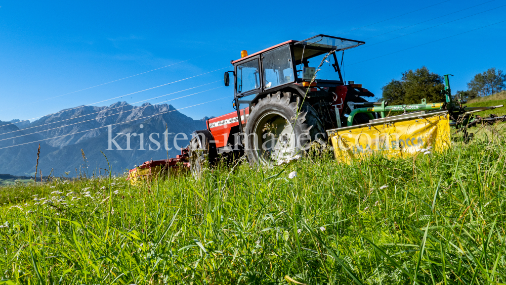 Traktor beim Mähen in Patsch, Tirol, Austria by kristen-images.com
