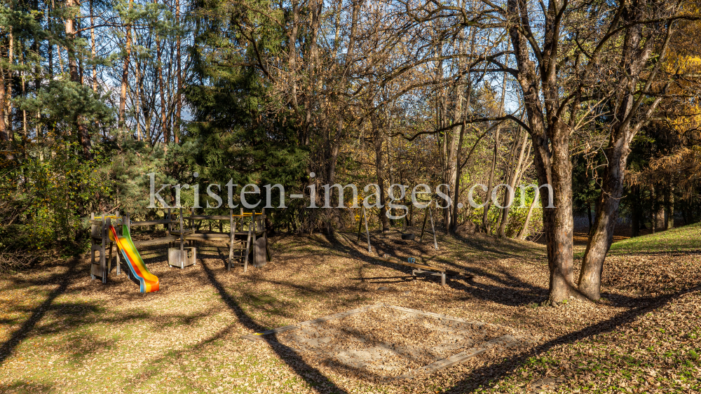 Spielplatz im Herbst in Igls, Gsetzbichl, Innsbruck, Tirol, Austria by kristen-images.com