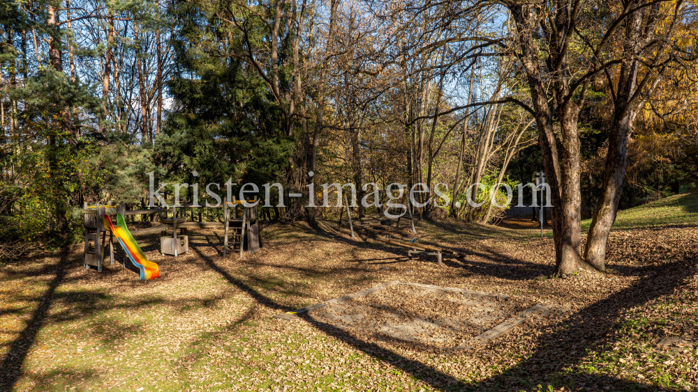 Spielplatz im Herbst in Igls, Gsetzbichl, Innsbruck, Tirol, Austria by kristen-images.com