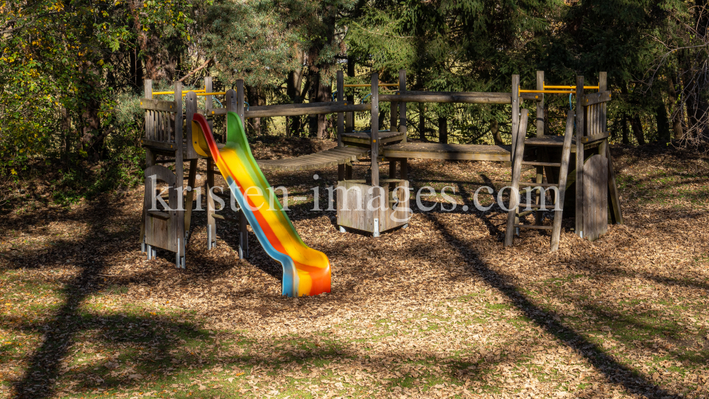 Spielplatz im Herbst in Igls, Gsetzbichl, Innsbruck, Tirol, Austria by kristen-images.com