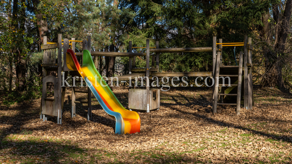 Spielplatz im Herbst in Igls, Gsetzbichl, Innsbruck, Tirol, Austria by kristen-images.com