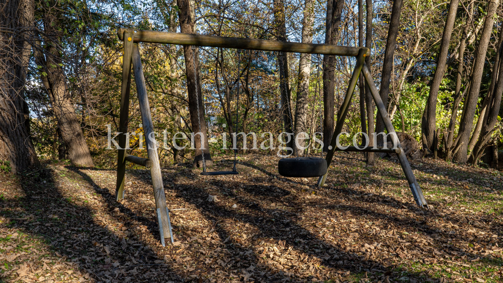 Spielplatz im Herbst in Igls, Gsetzbichl, Innsbruck, Tirol, Austria by kristen-images.com