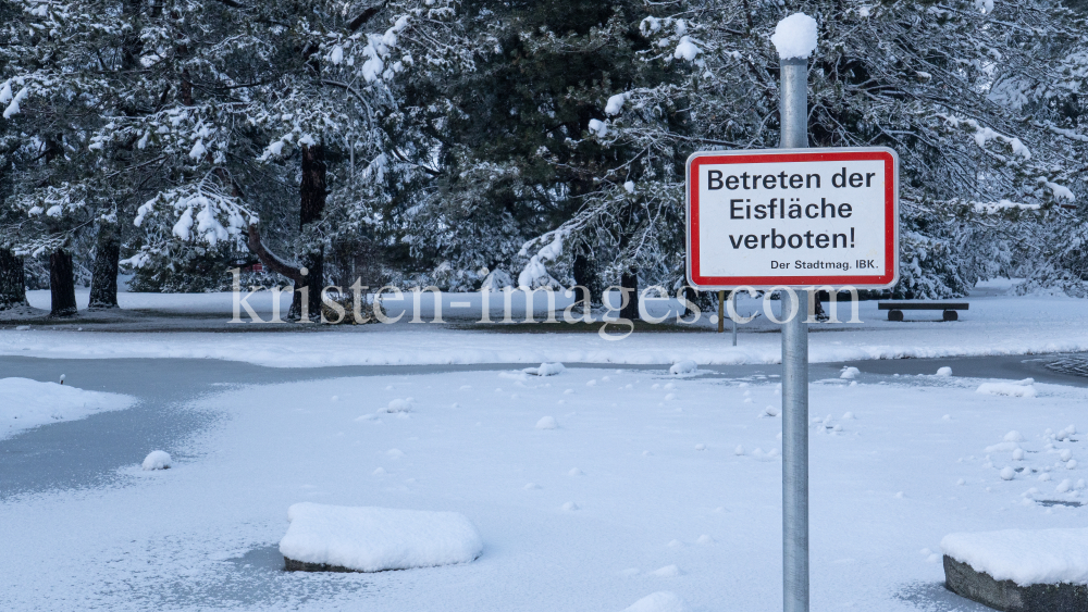 zugefrorener Teich im Kurpark Igls, Innsbruck, Tirol, Austria  by kristen-images.com