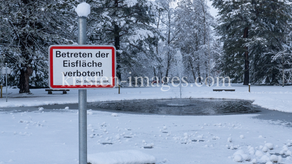 zugefrorener Teich im Kurpark Igls, Innsbruck, Tirol, Austria  by kristen-images.com